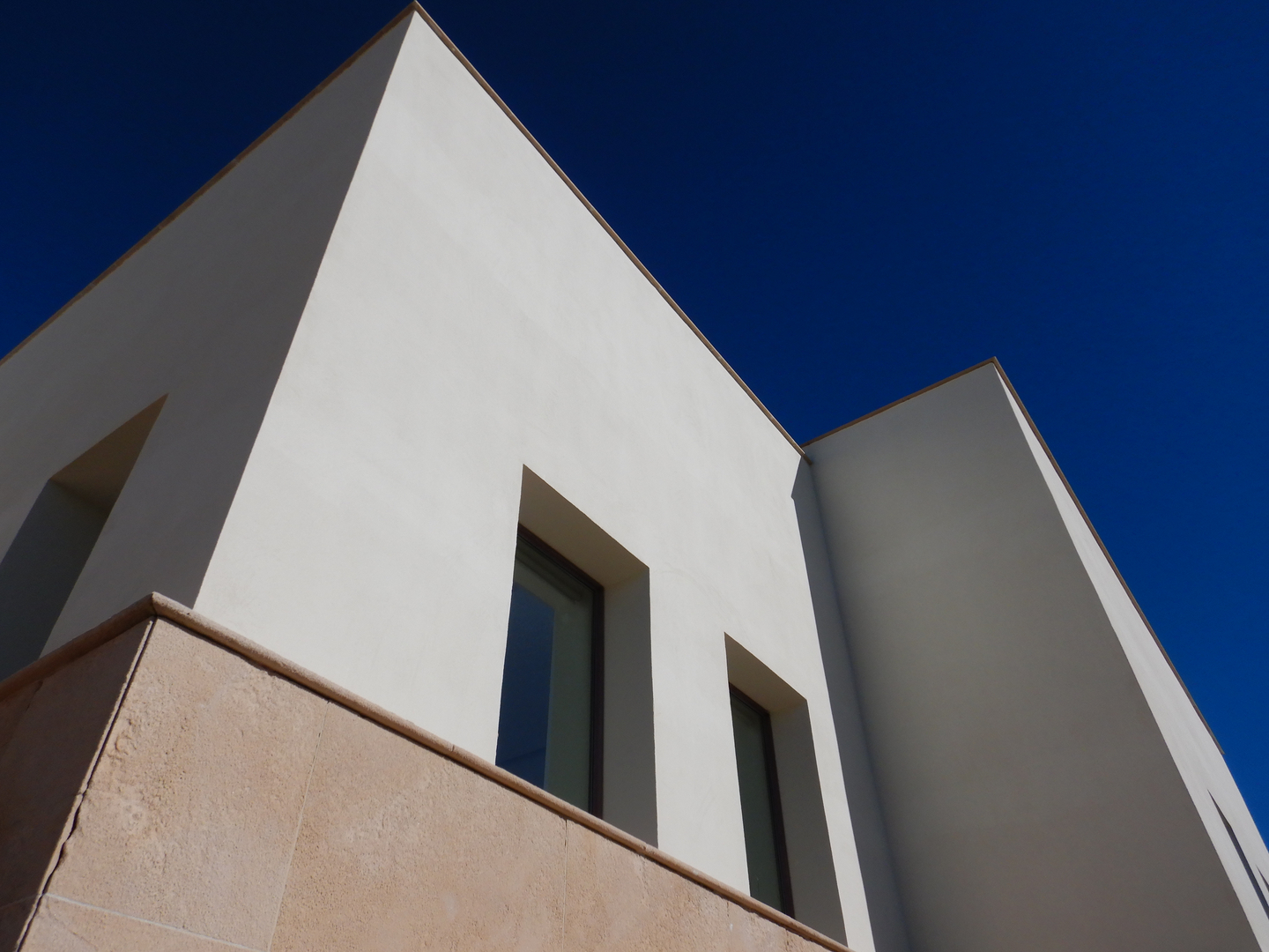 Modern minimalist building against blue sky
